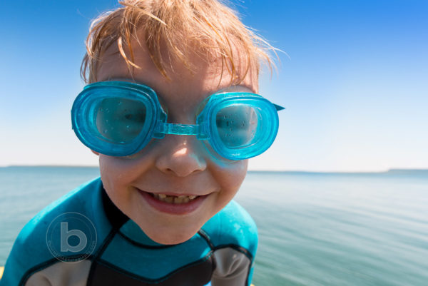 Boy_Jumping_Into_Lake_At_Summer_Cottage